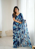 Elegant blue georgette saree with printed patterns and mirror work embellishments