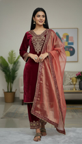 Model wearing a Maroon Velvet Kurta Set with intricate embroidery and sequence work