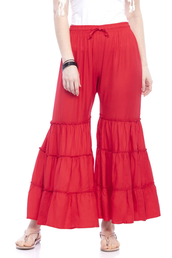 A pair of vibrant red solid rayon cotton palazzo pants with a relaxed silhouette.