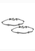 A beautiful double-lined oxidised silver anklet with intricate traditional patterns.