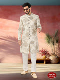 A man wearing a beige Swed Velvet Indo-Western kurta set with intricate self-design pattern.