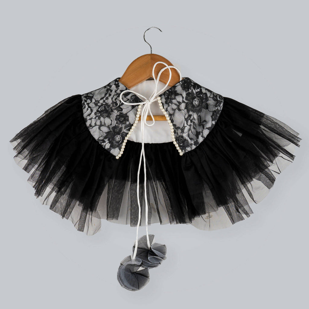 Black and white lace shrug with net frills, pearl details, and pom-pom dori tie-up.