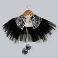 Black and white lace shrug with net frills, pearl details, and pom-pom dori tie-up.