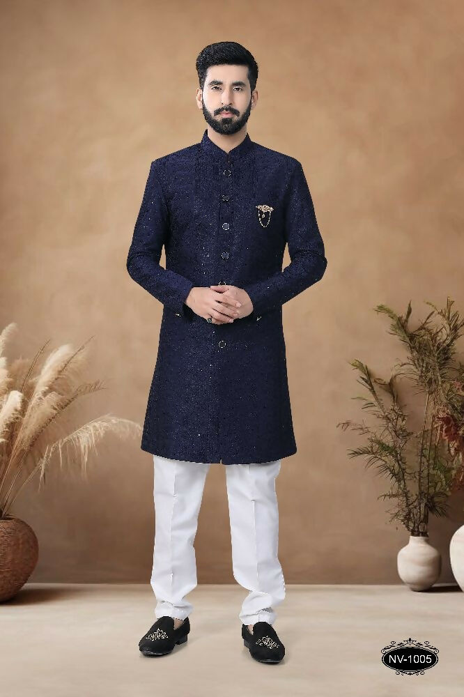 Men's blue silk Indo-Western kurta set featuring heavy all-over thread and sequence embroidery.