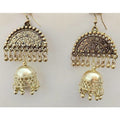 Gold-polished hanging Jhumka earrings with tassel detailing.