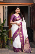 Lavender silk saree featuring zari woven checks and a decorative elephant motif border.