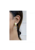 A pair of luxurious golden earrings featuring white AD stones set in brass.