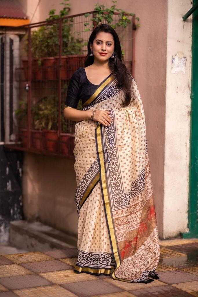 Cream geometric print silk blend saree with weaving pattu border and pallu tassels