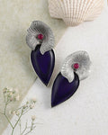 Bohemian style stud earrings in blue, purple, and magenta on a brass base