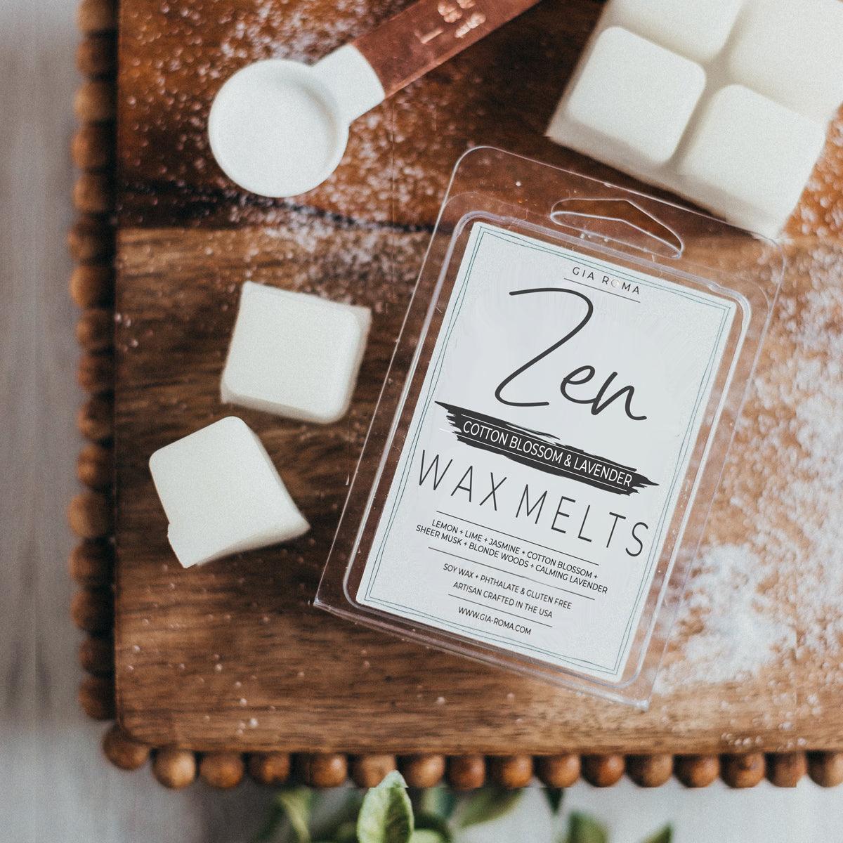 Zen branded wax melt packaging on a wooden surface with wax cubes