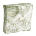 A rectangular bar of green and white marbled Zen natural soap