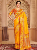 Vibrant yellow silk blend saree with a bold red contrast blouse.