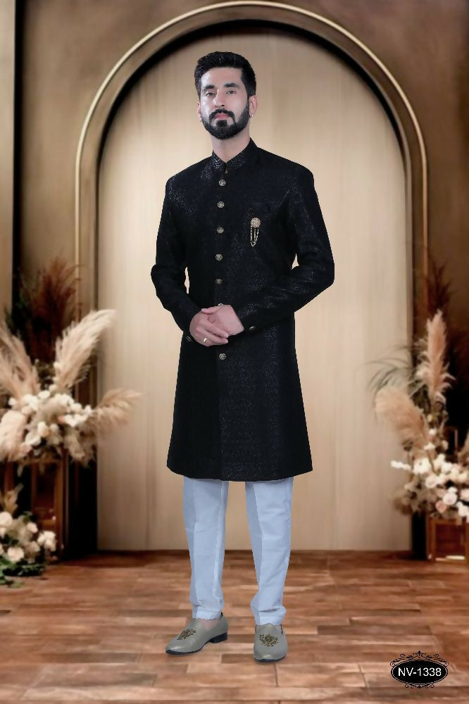 Toddler wearing a sleek black self-design TR fabric kurta with matching pyjama trousers