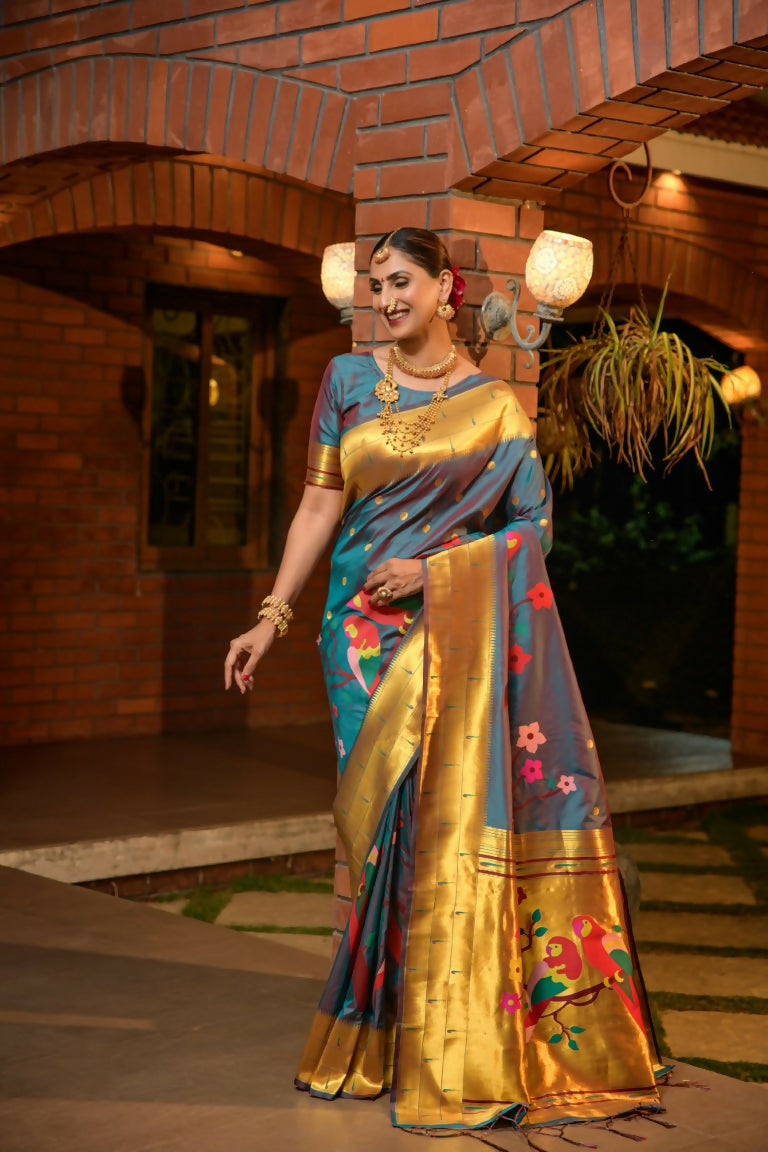 Elegant teal Paithani silk saree with intricate gold zari woven border and matching blouse