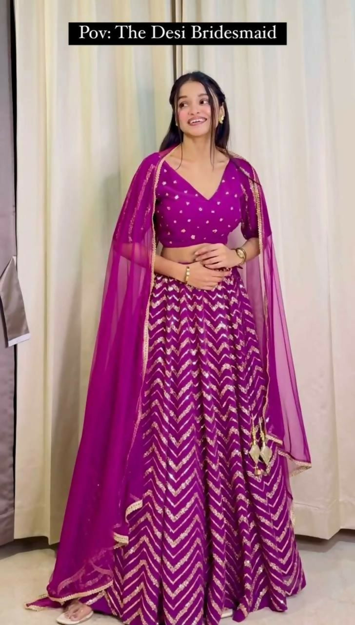 Wine colored faux georgette lehenga choli with sequin and thread embroidery