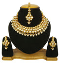 Handcrafted gold-plated Kundan stone necklace set on a neutral background
